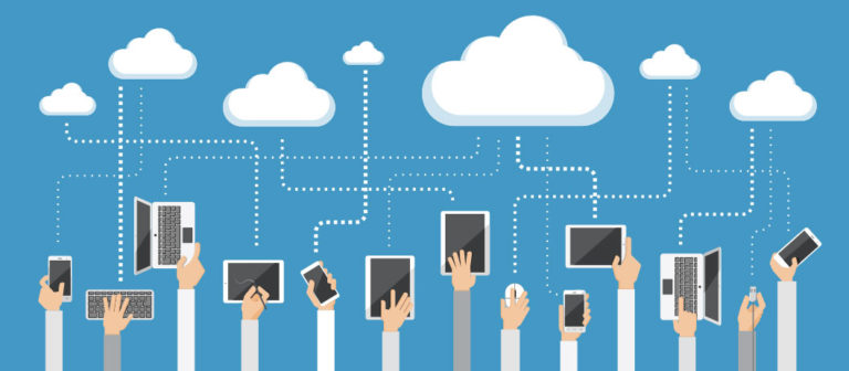 Hands holding mobile devices connected to the cloud.